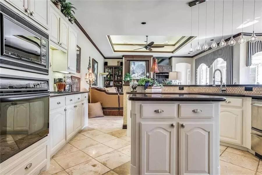 Notice the Elegant Lighting and Classic Cabinetry in This Kitchen