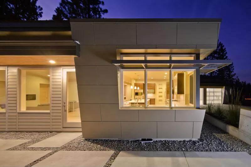 Catch the Playful Angles and Warm Glow of This Modern Exterior