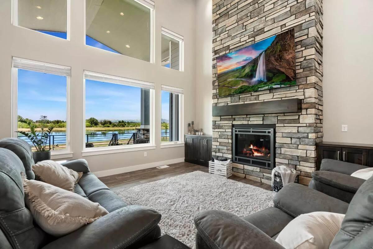 Wow, Look at That Stone Fireplace in the Spacious Lakefront Living Room