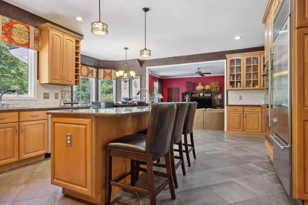 Explore This Inviting Kitchen with a Central Island and Bold Accents