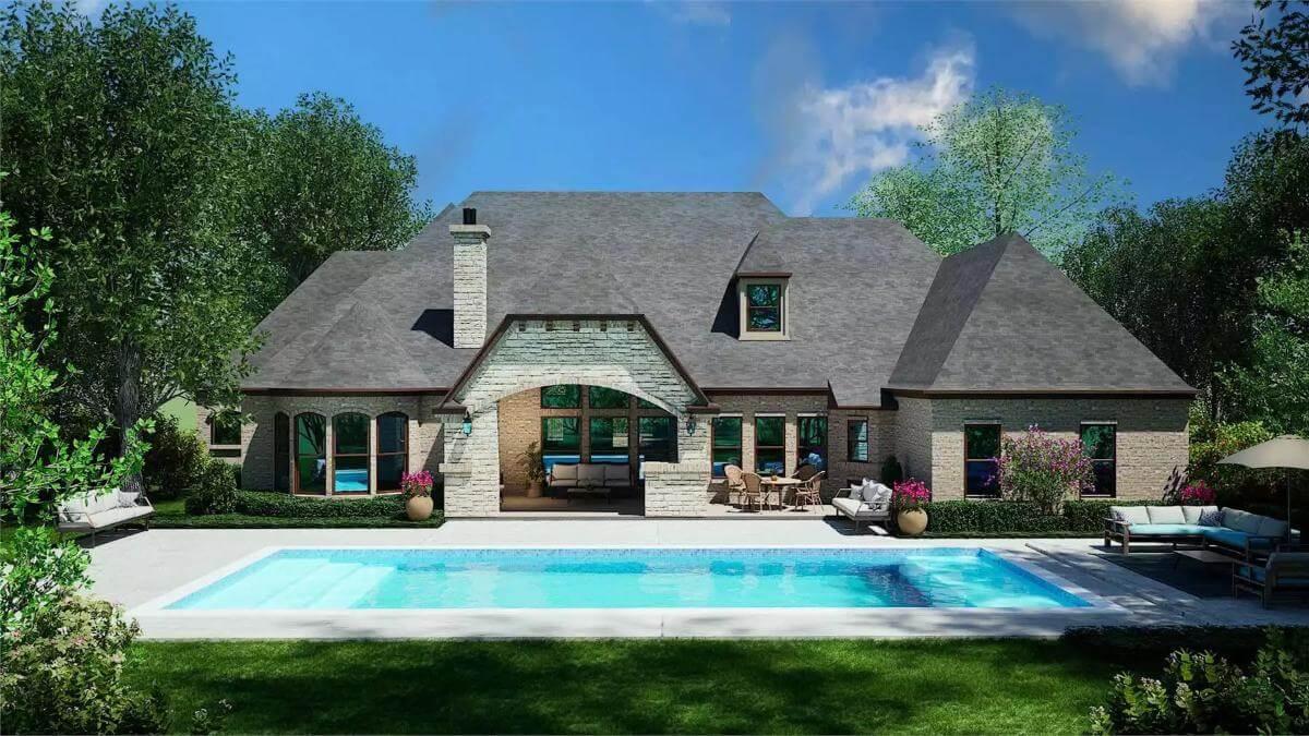 Dive into This Backyard Oasis with Stone Detailing
