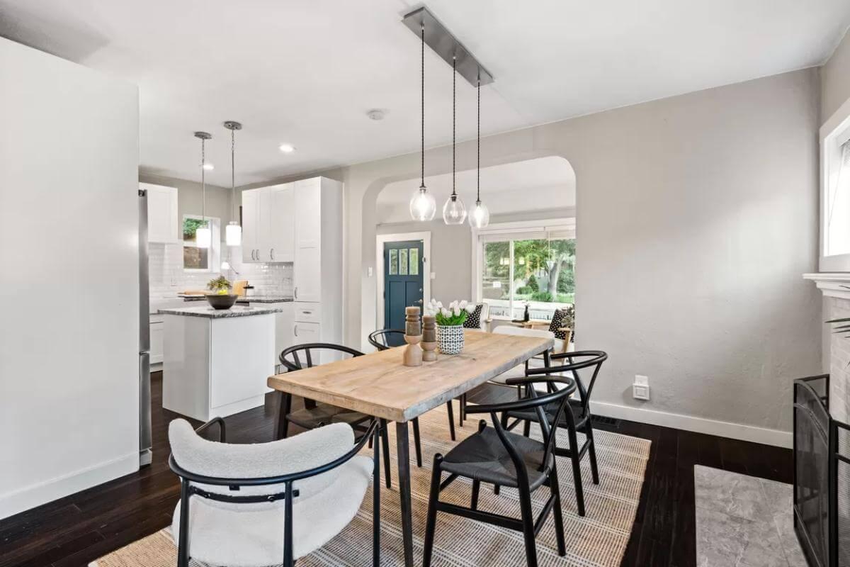 Wide Open Dining and Kitchen Combo with a View to the Craftsman Blue Door