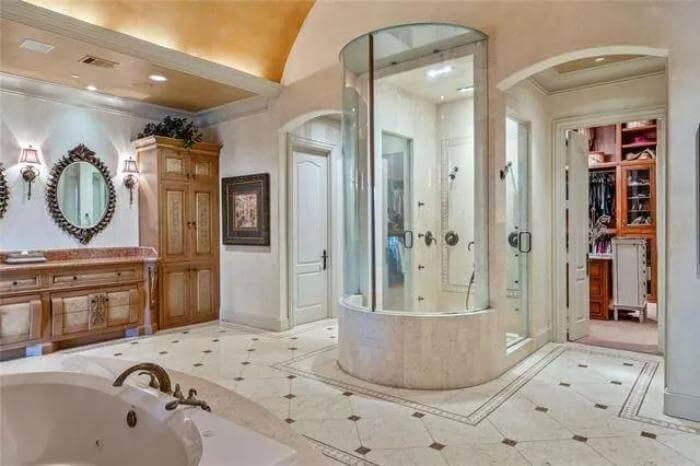 Spacious Bathroom Centered Around a Unique Circular Shower