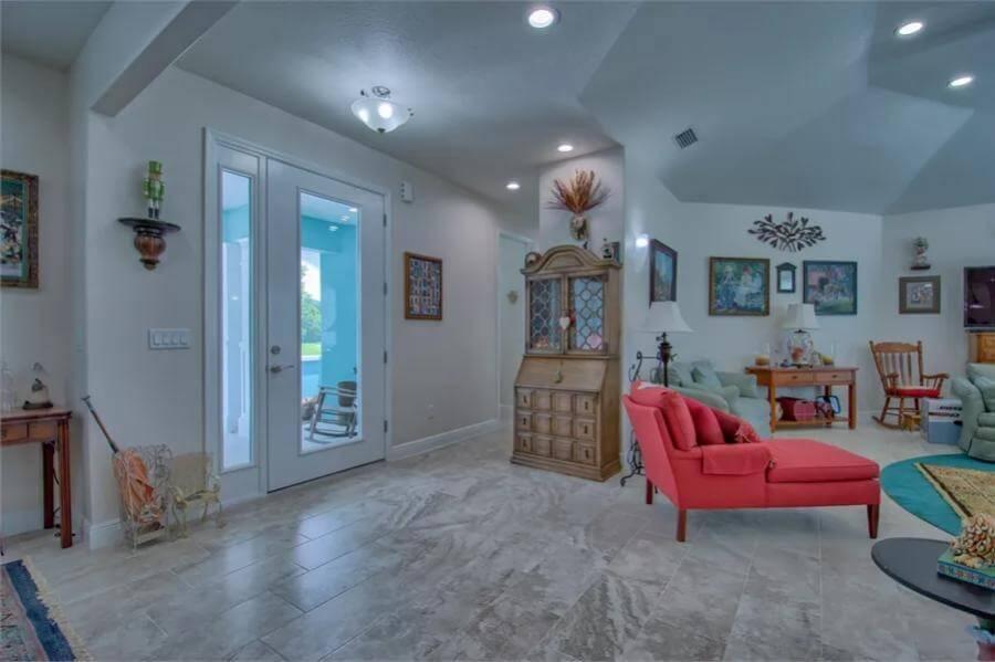 Look at the Pop of Color with This Red Lounge Chair and Eclectic Decor
