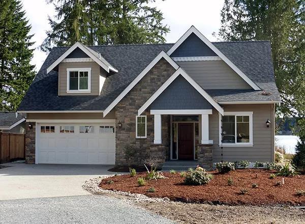 Craftsman Style with Rich Stone Facade and Inviting Porch