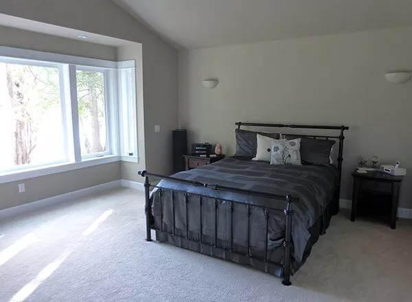 Simple Yet Stylish Bedroom with a Cozy Window Nook
