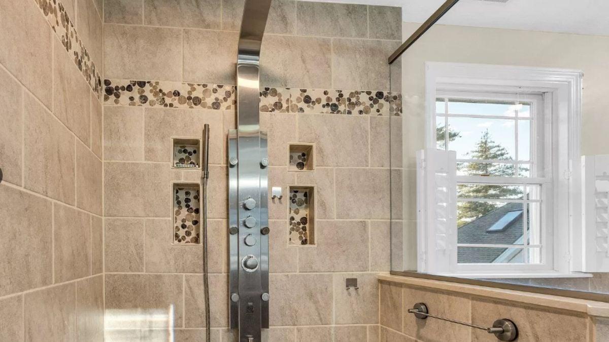 Check Out the Sleek Shower Fixture and Window in This Spa Bath