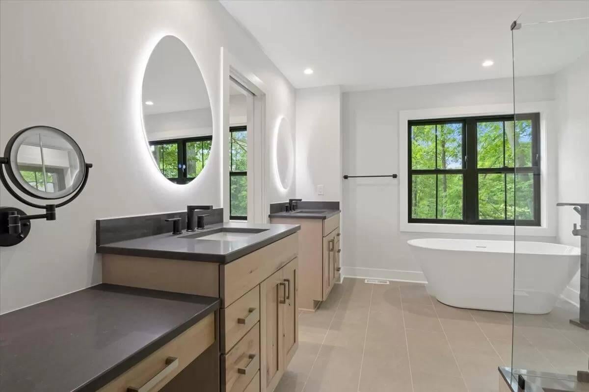 Freestanding Tub and Glowing Mirrors in a Craftsman Retreat