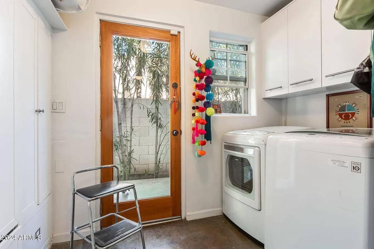 Charming Laundry Room Featuring Playful Pops of Color