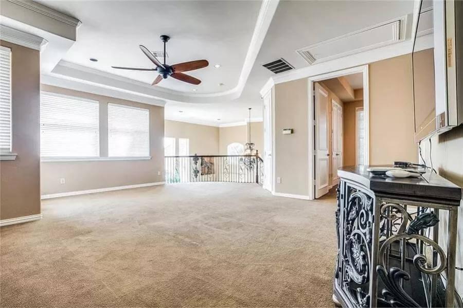 Check Out the Spacious Loft with a Statement Ceiling Fan