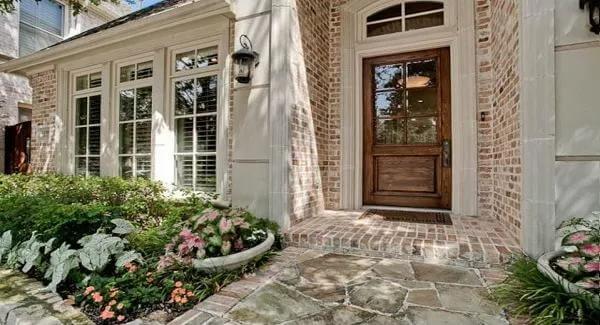Craftsman Entryway with Rustic Wooden Door and Brick Detail