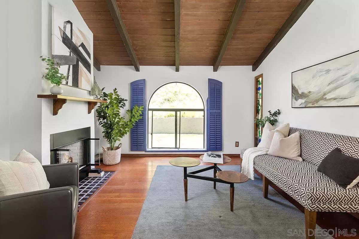 Notice the Bold Blue Shutters Enhancing This Cozy Living Room