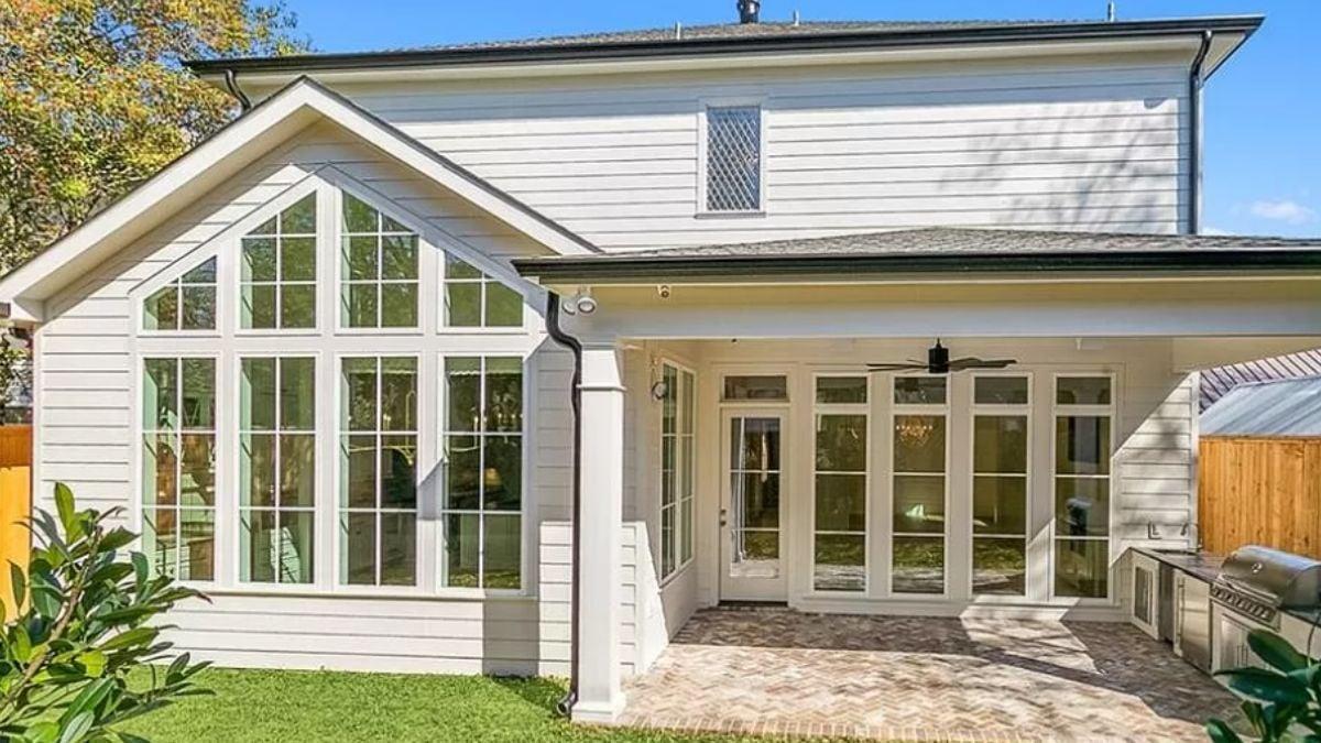 Admire the Expansive Windows in This Sunny Back Patio