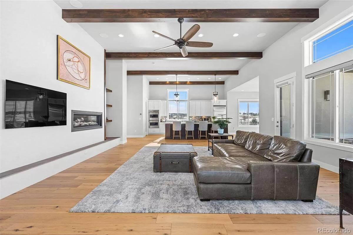 Spotlight on the Stylish Living Area with Sleek Fireplace and Wooden Accents