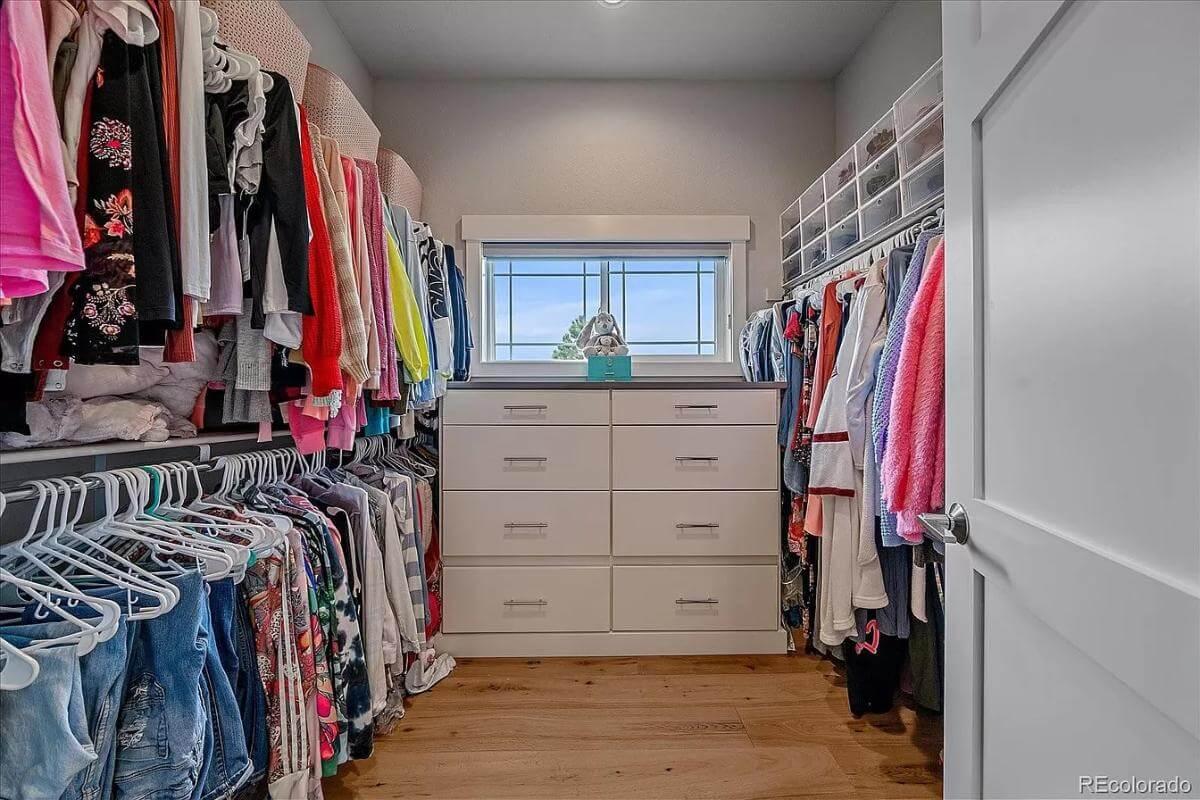 Peek Inside This Walk-In Closet with Well-Organized Shelving