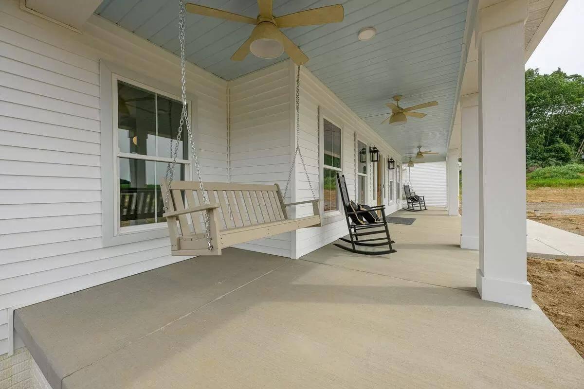 Relax on This Porch with a Swing and Rocking Chairs