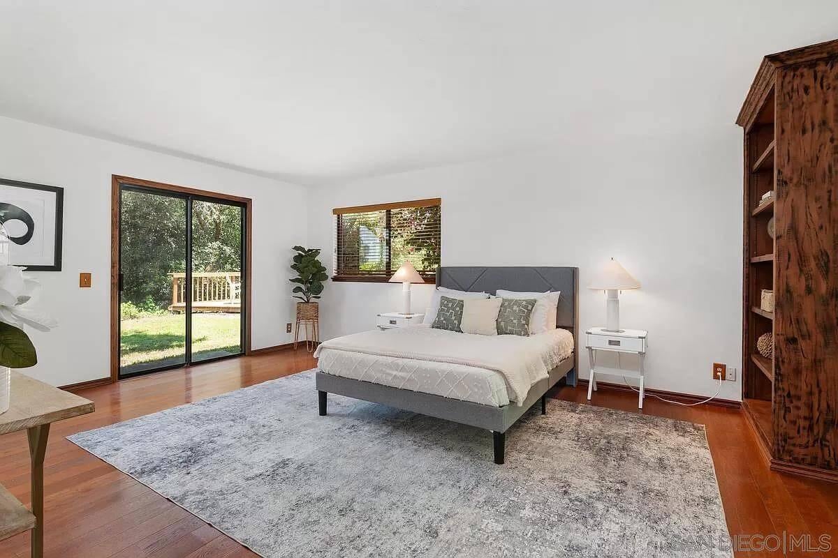 Step Into This Bright Bedroom with Sliding Doors to Nature