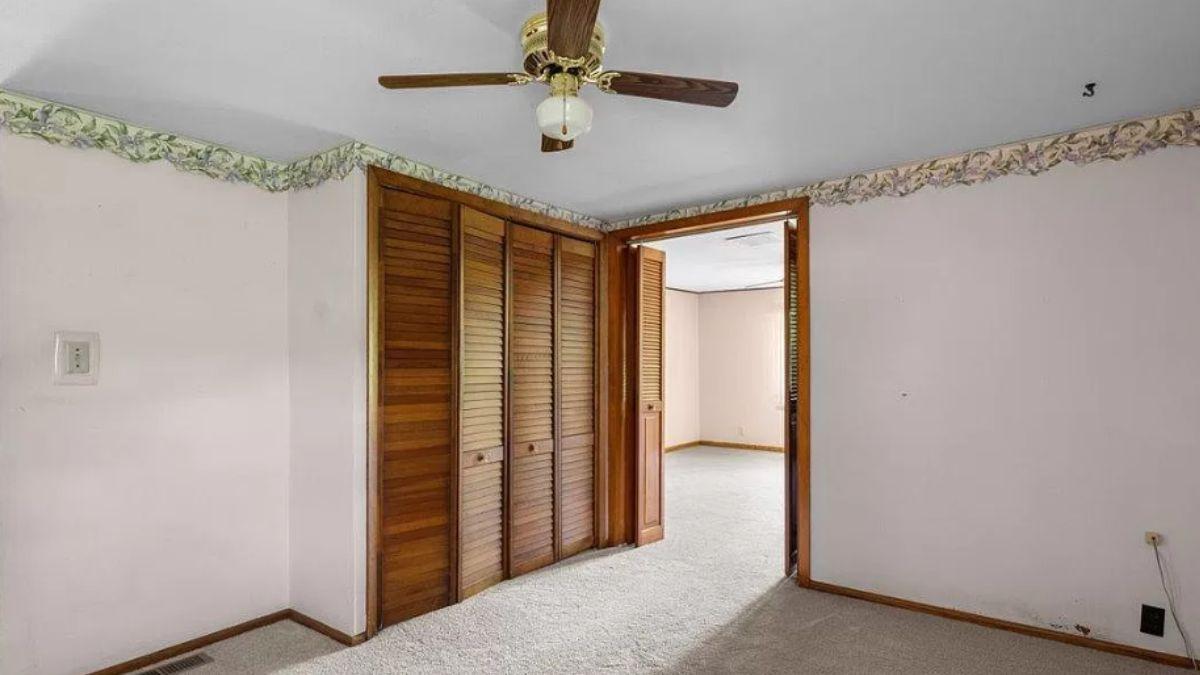 Notice the Vintage Closet Doors and Floral Border in This Room