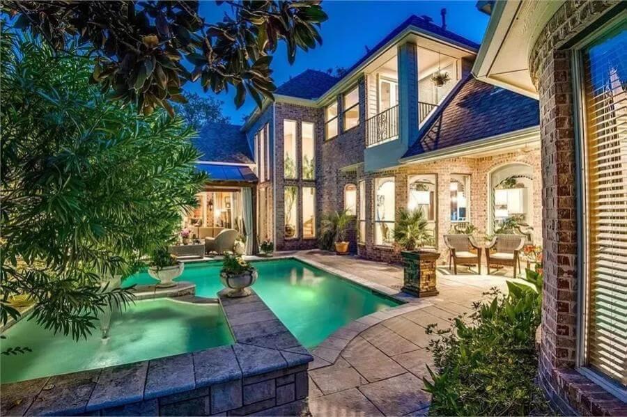 Enjoy a Tranquil Evening in This Lush Courtyard with a Sparkling Pool