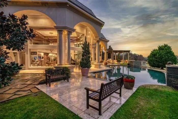 Experience the Serenity of This Arched Poolside Retreat