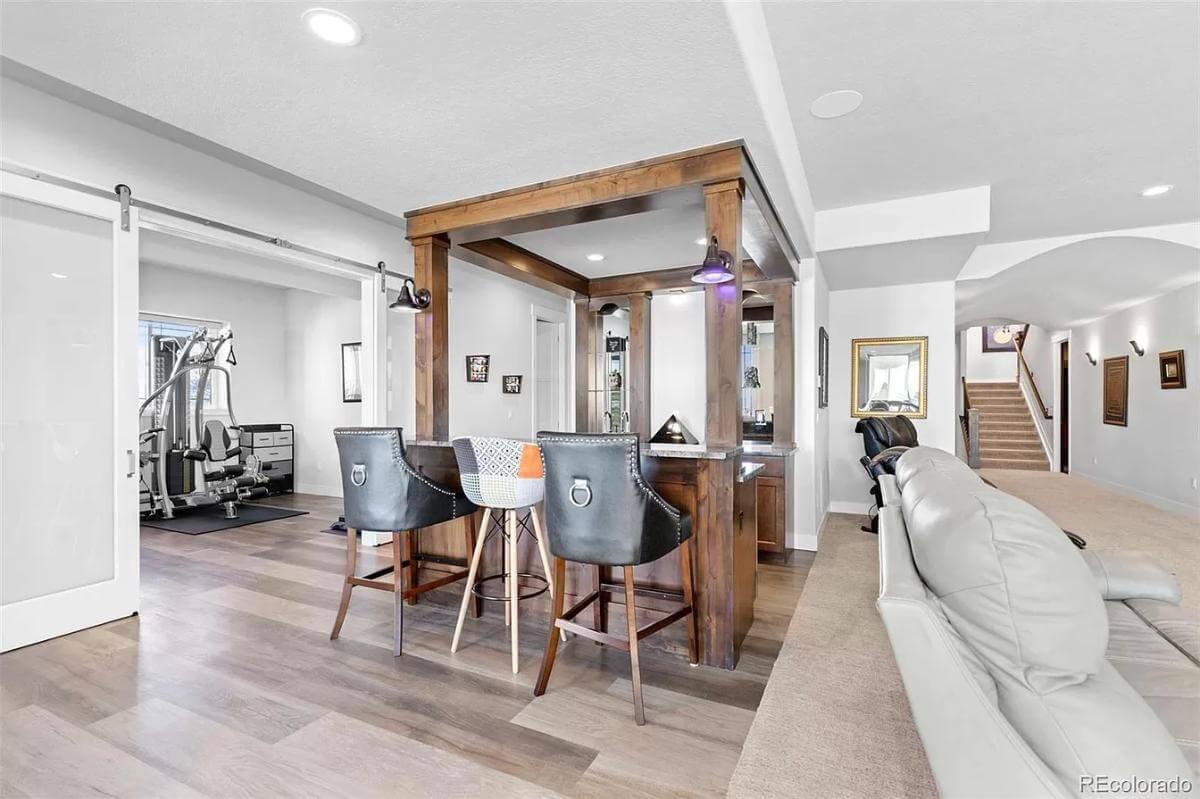 Check Out the Inviting Bar Setup in This Multi-Functional Basement