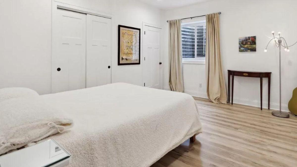 Simple and Sleek Bedroom with Floor Lamp Accent