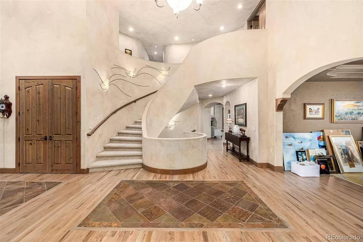 Gently Curving Stairway in a Spacious Entry Hall