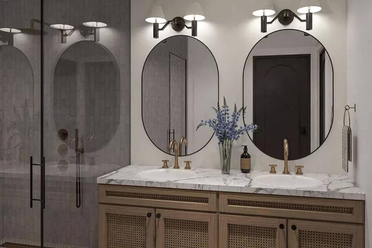 Bathroom Serenity with Elegant Arched Mirrors and Brass Fixtures