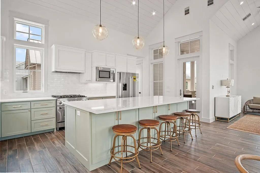 Check Out the Soft Green Island in This Bright Kitchen
