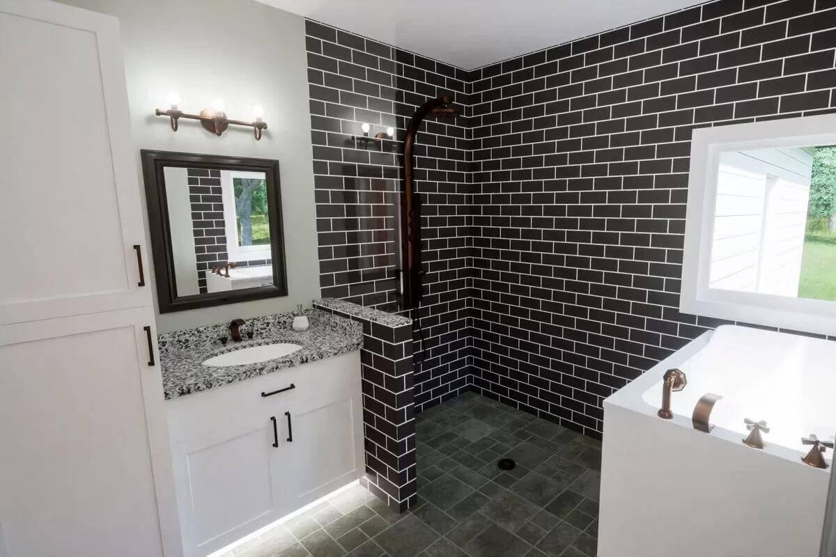 Stylish Modern Bathroom Featuring a Bold Dark Tile Walk-In Shower