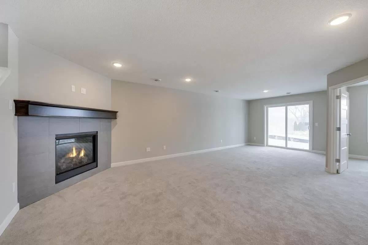 Spot the Minimalist Fireplace in This Spacious Family Room