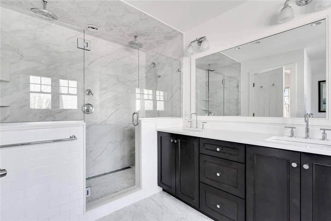 Sleek Double Vanity and Corner Shower in a Polished Bathroom