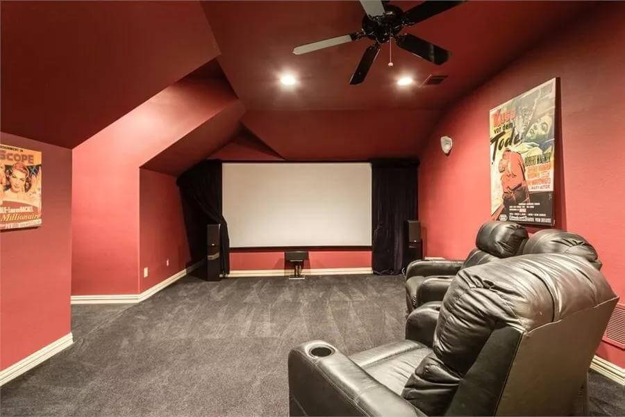 Unwind in This Bold Home Theater with Vintage Poster Flair