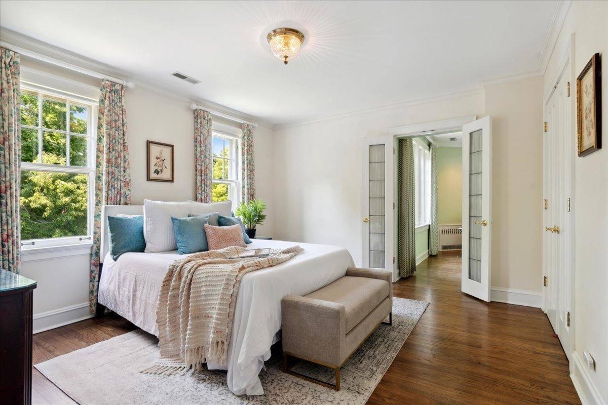 Bright Bedroom with Floral Curtains and a Touch of Elegance