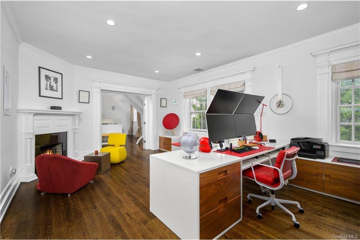 Modern Home Office with Bold Pops of Color and a Cozy Fireplace