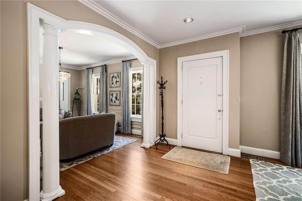 Thoughtfully Framed Archway Leading to a Sunlit Living Room