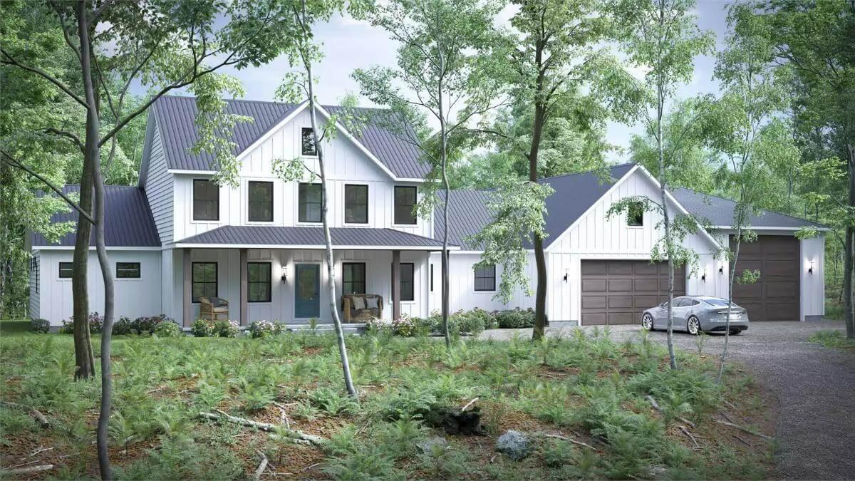 Farmhouse Elegance with a Sleek Metal Roof Standing Out Among Lush Woods