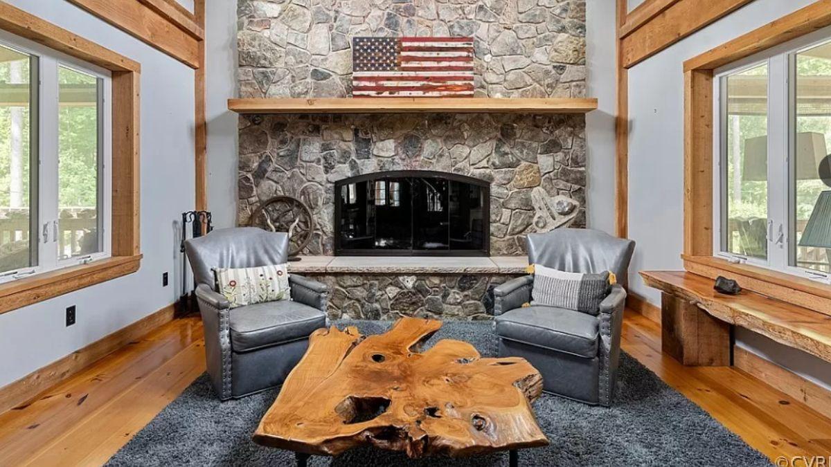 Check Out This Rustic Lounge with a Striking Stone Fireplace