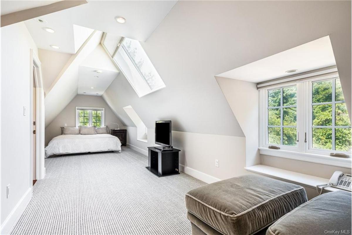 Look at the Unique Angles and Skylights in This Cozy Attic Retreat