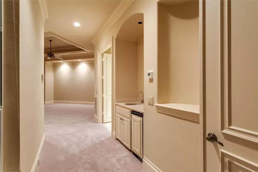 Check Out This Hallway with Built-In Wet Bar - Perfect for Hosting