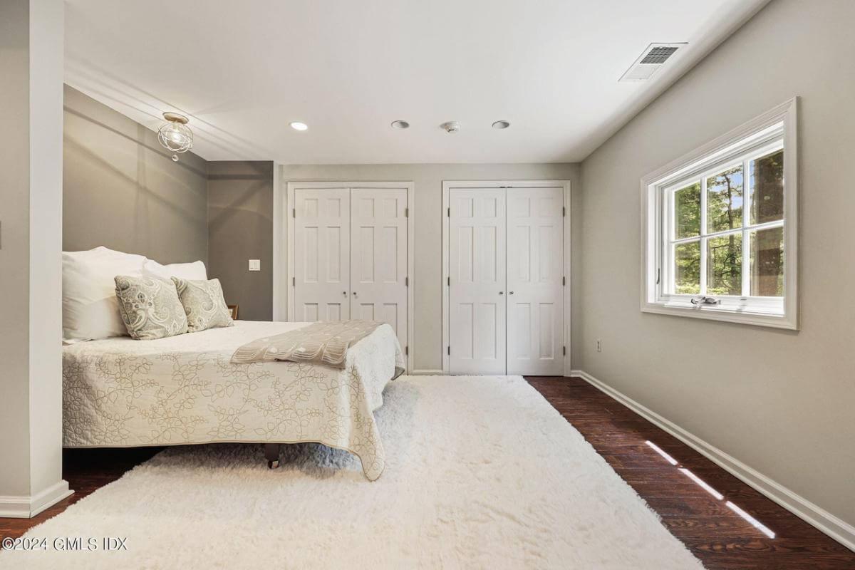 Serene Bedroom with Dual Closets and Soft Lighting