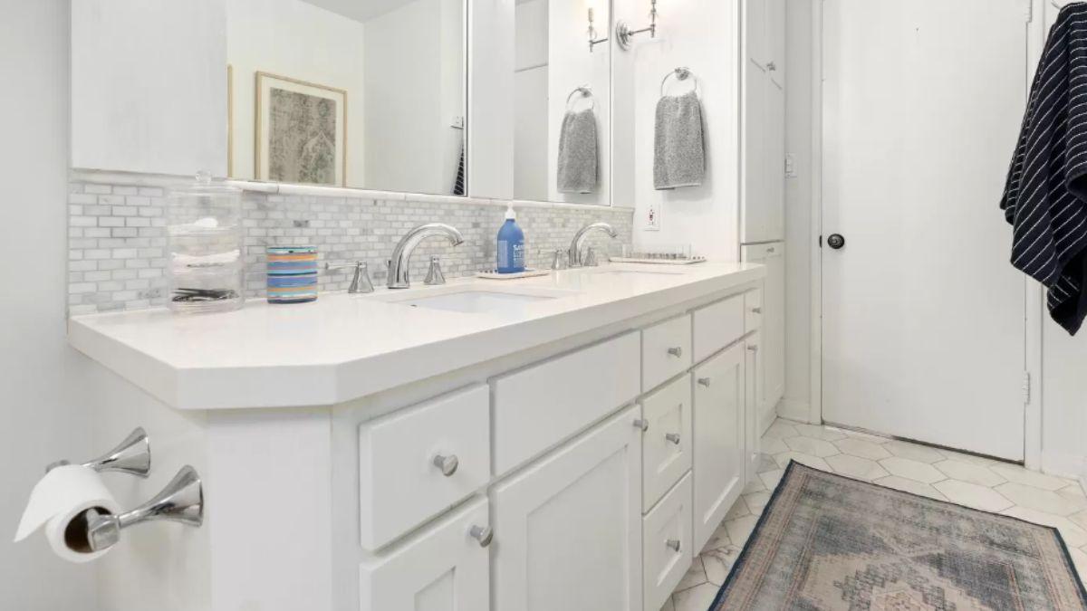 Modern White Bathroom with Double Vanity and Subtle Tile Details