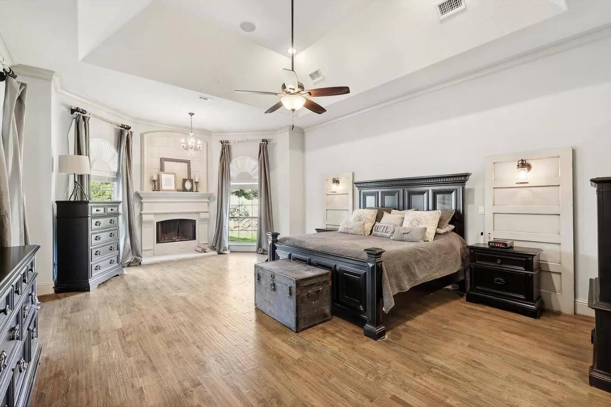 Luxurious Primary Suite with Cozy Fireplace and Elegant Details