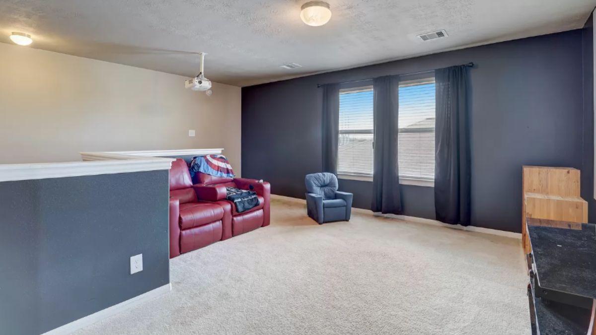 Media Loft with Built-In Projector and Plush Seating
