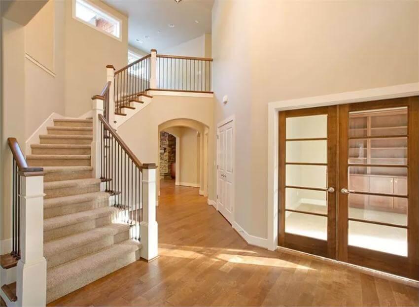 Notice the Elegant Curved Staircase in This Craftsman Entry