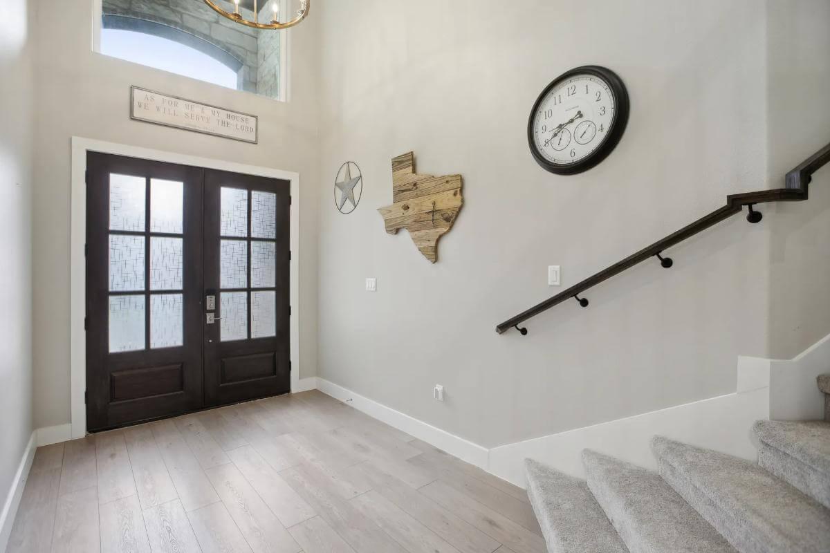 Discover the Grand Entryway with Textured Glass Double Doors