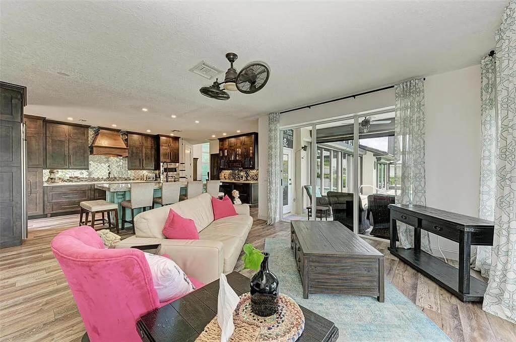 Lively Living Room and Kitchen Combo with Bold Color Accents