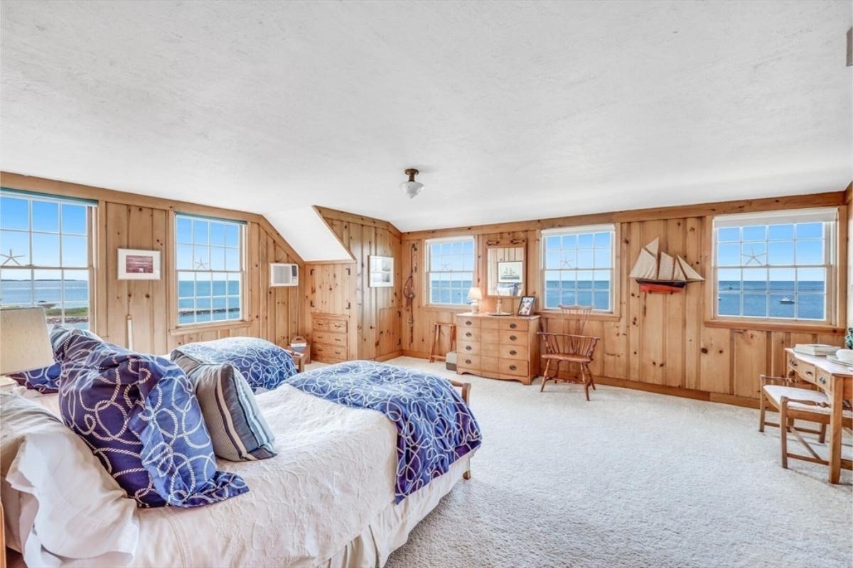 Twin Bedroom Offering Ocean Views and Nautical Accents