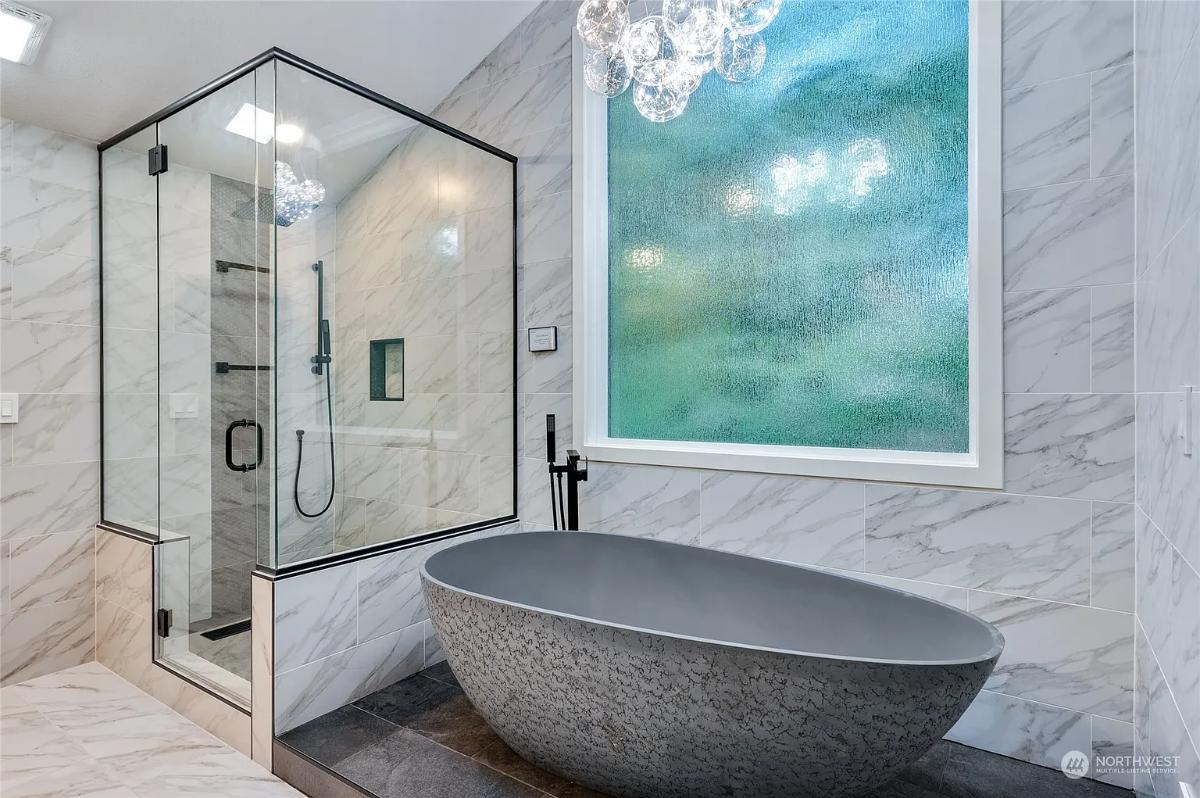 Wow, Look at the Sculpted Tub Set Against Pebbled Marble Walls