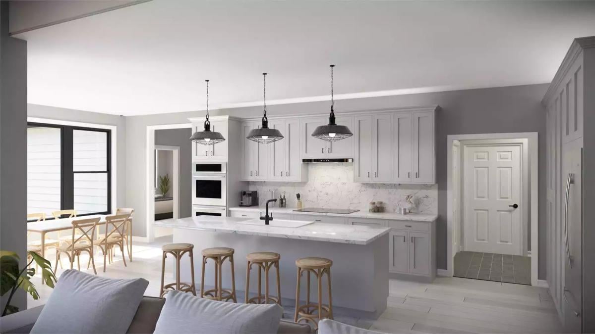 Look at Those Industrial Pendants Over This Chic White Kitchen